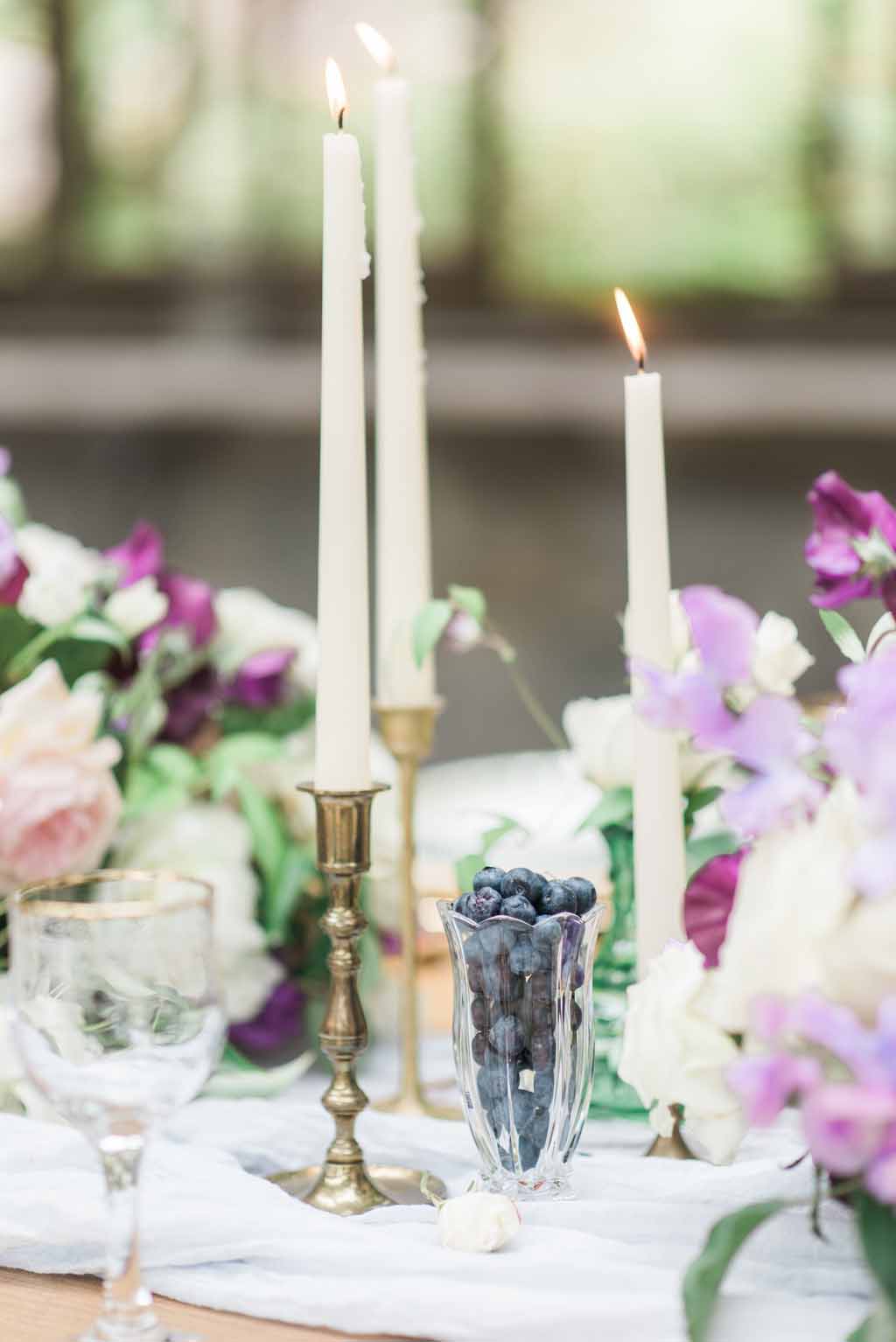 Bella Fiori Florist - Bella Luna Farms - Becca Jones Photography - Snohomish Washington - table decor designed by Alicia of Bella Fiori. Floral centerpiece created with garden roses, sweet peas, anemones, clematis in purple, lavender, and white. Blueberries and blackberries added a touch of blue to the centerpiece.