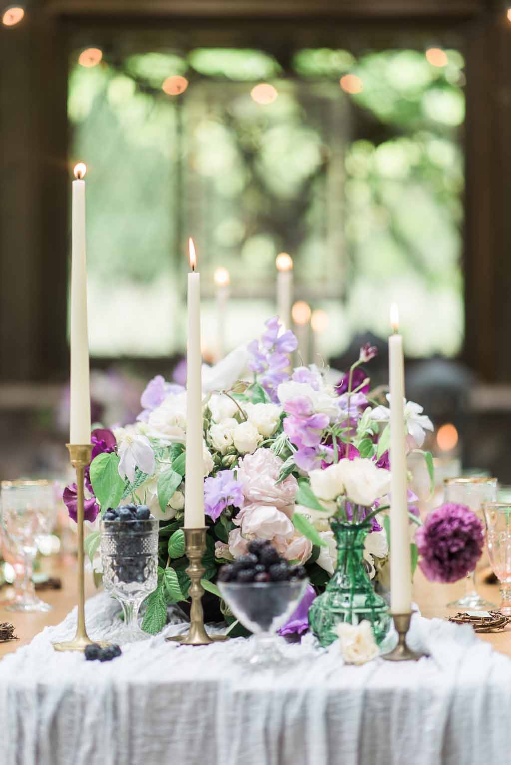 Bella Fiori Florist - Bella Luna Farms - Becca Jones Photography - Snohomish Washington - table decor designed by Alicia of Bella Fiori. Floral centerpiece created with garden roses, sweet peas, anemones, clematis in purple, lavender, and white. Blueberries and blackberries added a touch of blue to the centerpiece.