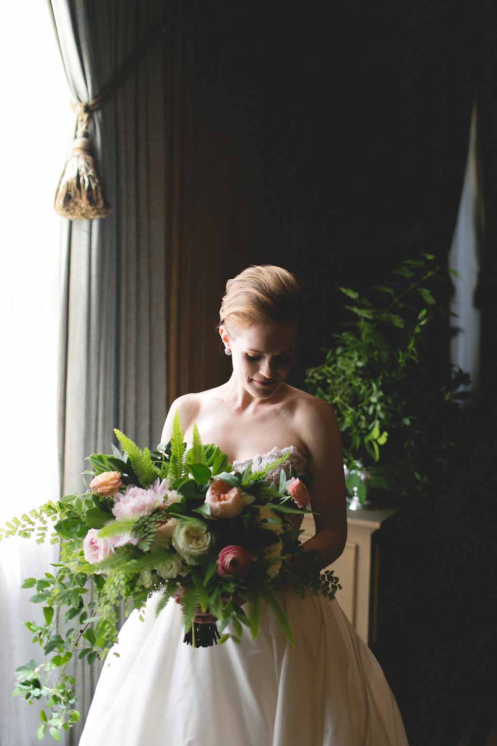 Bella Fiori, Seattle Wedding Florist, Fairmont Olympic Hotel - Large and lush bridal bouquet with maiden hair ferns, vines, peach garden roses, ranunculus, peonies