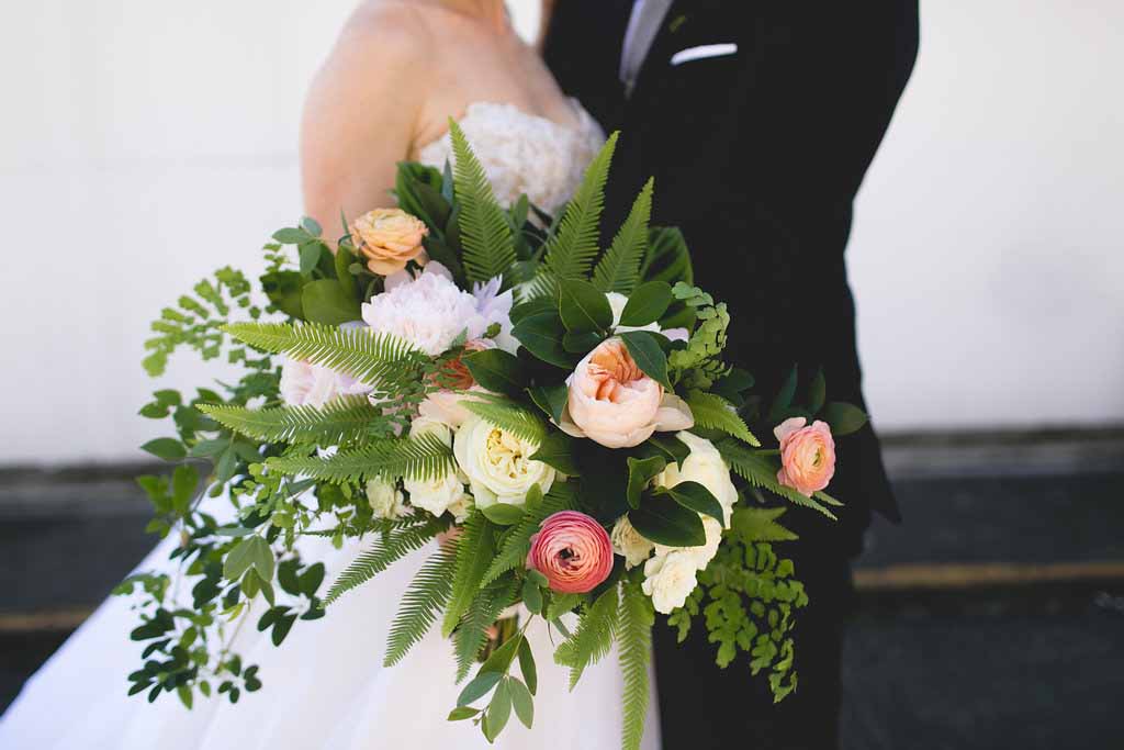 Bella Fiori, Seattle Wedding Florist, Fairmont Olympic Hotel - Large and lush bridal bouquet with maiden hair ferns, vines, peach garden roses, ranunculus, peonies